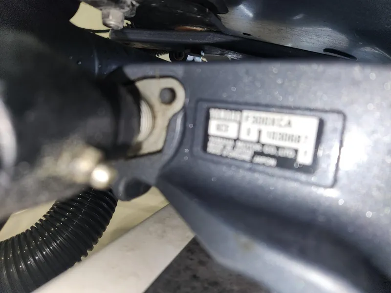 Slide: The Image of Close-up of a 2016 Key West 281 Billistic boat engine component with label. - 28