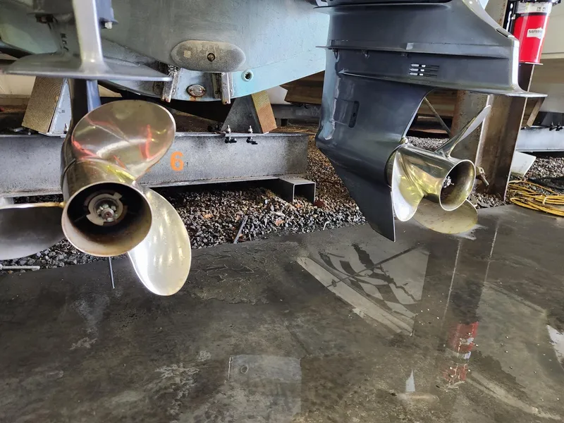 Slide: The Image of 2016 Key West 281 Billistic boat propellers in a garage setting. - 30