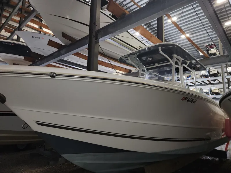 Slide: The Image of 2016 Key West 281 Billistic boat in storage, showcasing sleek design and sturdy build. - 4