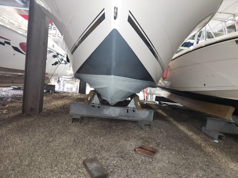 Slide: The Image of 2016 Key West 281 Billistic boat stored on a gravel surface in a marina. - 8