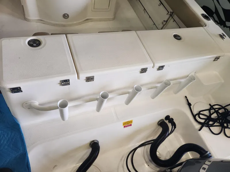 Slide: The Image of 2016 Key West 281 Billistic boat deck with storage compartments and rod holders. - 9