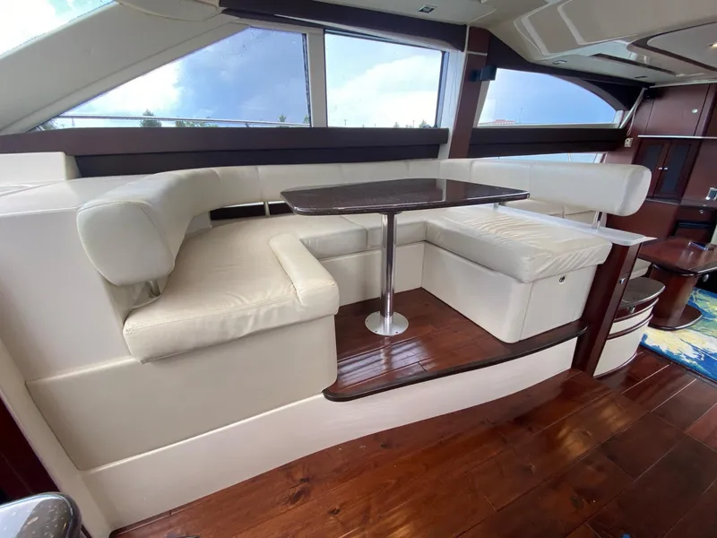 Slide: The Image of Luxurious interior of 2014 Meridian 441 Sedan yacht with elegant seating and wooden flooring. - 11