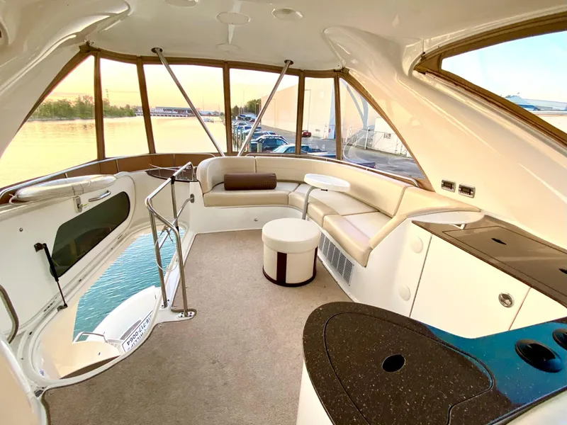 Slide: The Image of Luxurious interior of 2014 Meridian 441 Sedan yacht with panoramic windows and plush seating. - 18