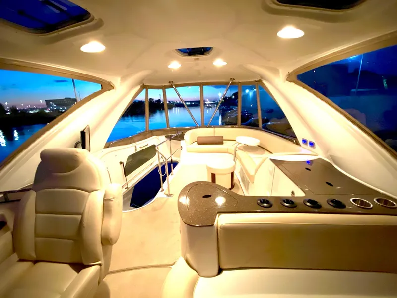 Slide: The Image of Luxurious interior of a 2014 Meridian 441 Sedan yacht with elegant seating and panoramic windows. - 20