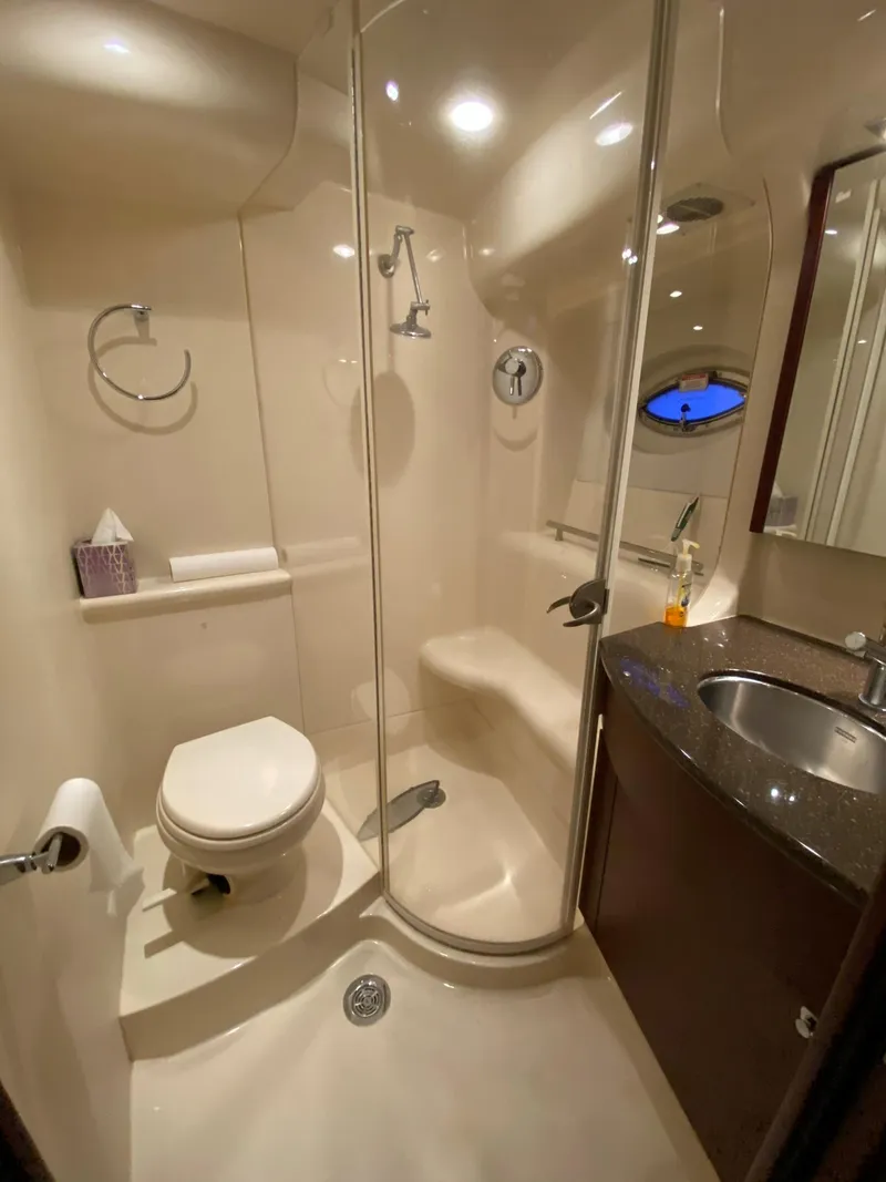Slide: The Image of 2014 Meridian 441 Sedan yacht bathroom with shower, toilet, and sink. - 15