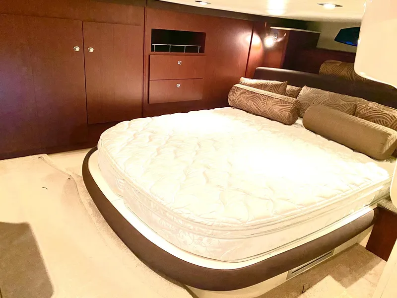 Slide: The Image of Luxurious bedroom interior of 2014 Meridian 441 Sedan yacht with plush bedding. - 13