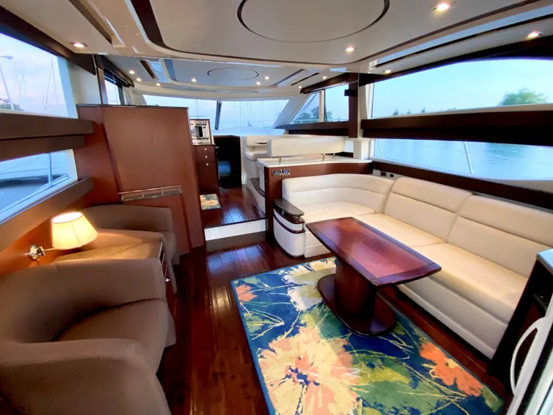 Slide: The Image of Luxurious interior of a 2014 Meridian 441 Sedan yacht with elegant seating and vibrant rug. - 8