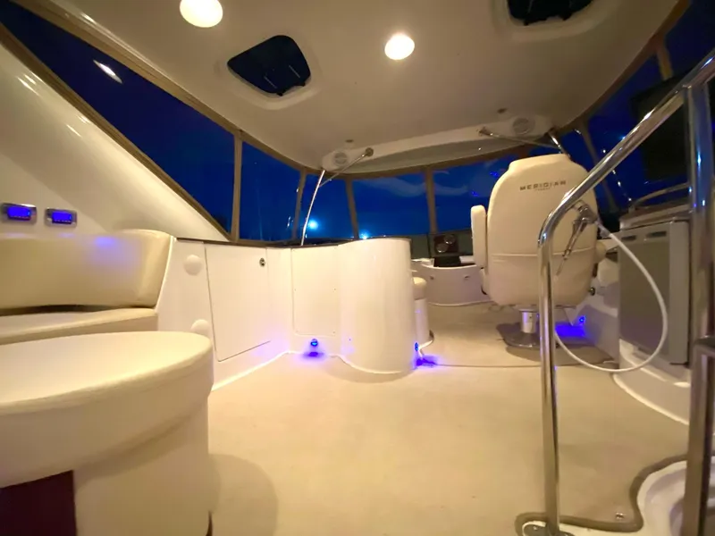 Slide: The Image of Luxurious interior of 2014 Meridian 441 Sedan yacht with modern seating and ambient lighting. - 21