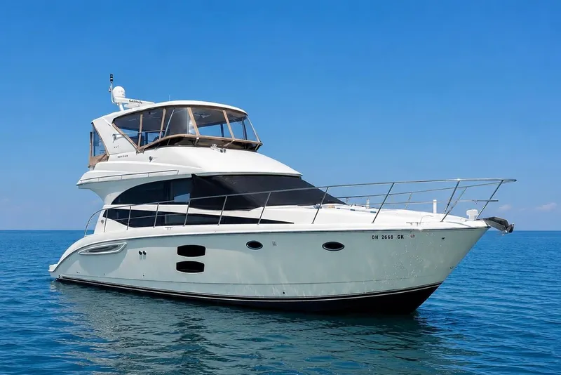 Slide: The Image of 2014 Meridian 441 Sedan yacht cruising on clear blue waters. - 25