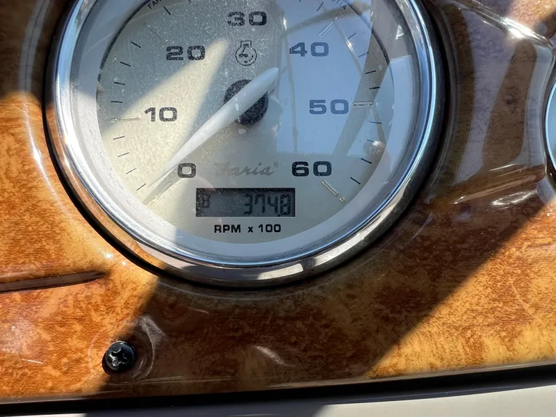 Slide: The Image of Close-up of 2008 Rinker 260 Express Cruiser speedometer showing 374.8 hours. - 12