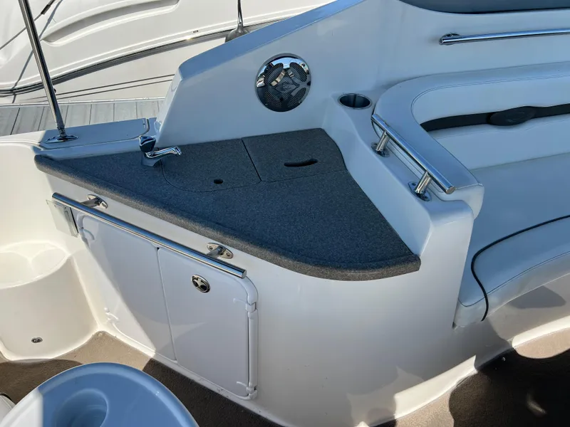 Slide: The Image of 2008 Rinker 260 Express Cruiser interior with seating and counter space. - 5