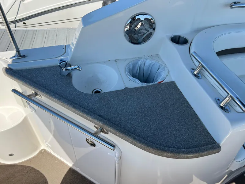 Slide: The Image of 2008 Rinker 260 Express Cruiser boat interior with sink and countertop. - 6