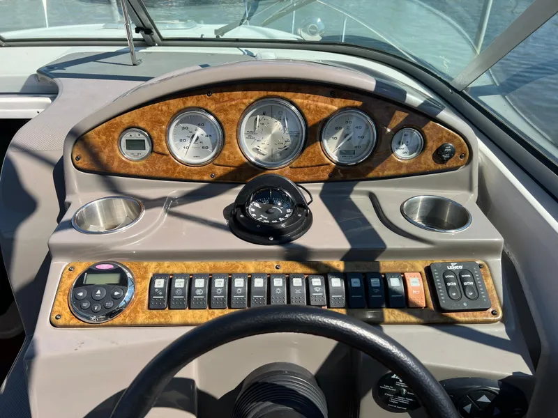 Slide: The Image of Dashboard of 2008 Rinker 260 Express Cruiser with gauges and controls. - 9