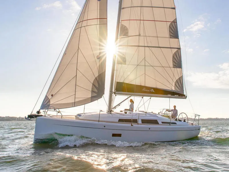 Slide: The Image of 2025 Hanse 348 sailboat gliding on sunny waters. - 4