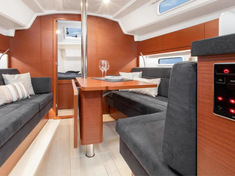 Slide: The Image of Interior of 2025 Hanse 348 yacht with modern seating and dining area. - 5