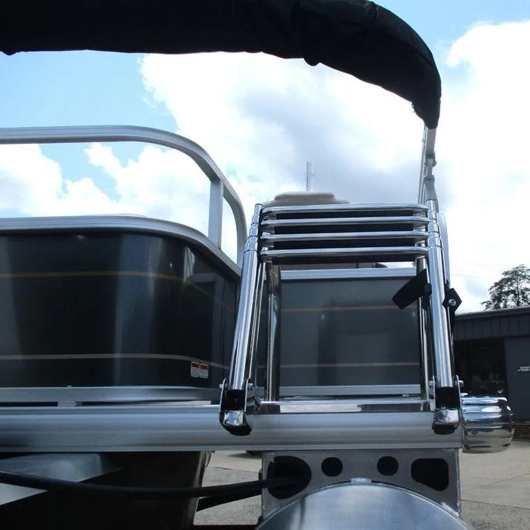 Slide: The Image of 2024 Sun Tracker PARTY BARGE® 18 DLX with foldable ladder against blue sky. - 10