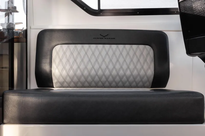 Slide: The Image of Jasper Marine Defender 22, 2026 model, featuring luxurious black and gray diamond-stitched seating. - 32