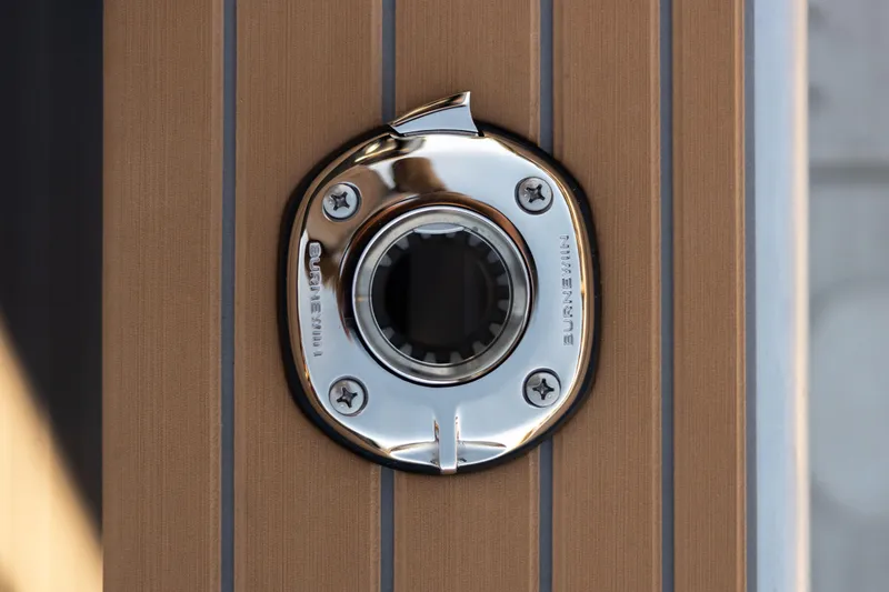 Slide: The Image of Chrome boat fitting on Jasper Marine Defender 22, 2026 model, with wood paneling. - 35