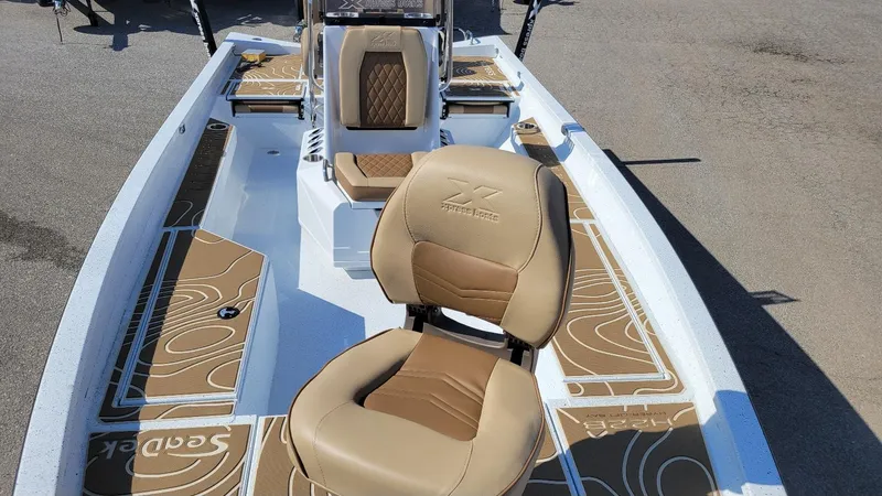 Slide: The Image of 2025 Xpress H22 Bay boat with Yamaha Vmax 175 SHO, featuring tan seating and deck. - 13