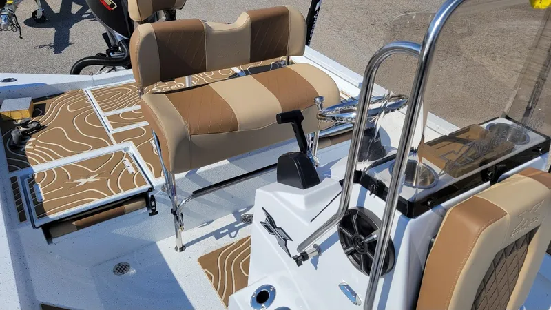 Slide: The Image of 2025 Xpress H22 Bay boat interior with Yamaha Vmax 175 SHO engine, featuring tan seating and controls. - 16