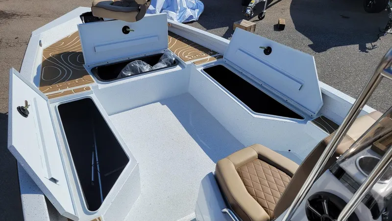 Slide: The Image of 2025 Xpress H22 Bay boat interior with storage compartments and seating, featuring Yamaha Vmax 175 SHO. - 4