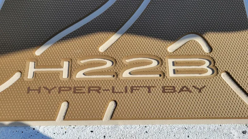 Slide: The Image of Textured mat displaying "H22B Hyper-Lift Bay" for Xpress 2025 model boat. - 5