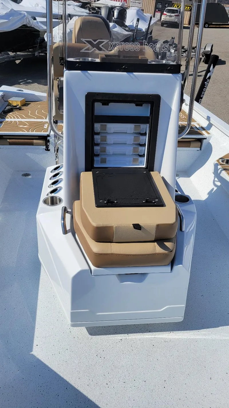Slide: The Image of 2025 Xpress H22 Bay boat interior with storage and seating, featuring Yamaha Vmax 175 SHO. - 6