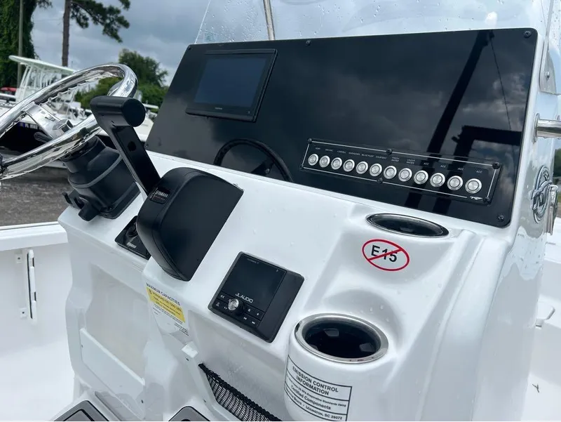 Slide: The Image of 2025 Tidewater 2110 Baymax boat console with steering wheel and control panel. - 10