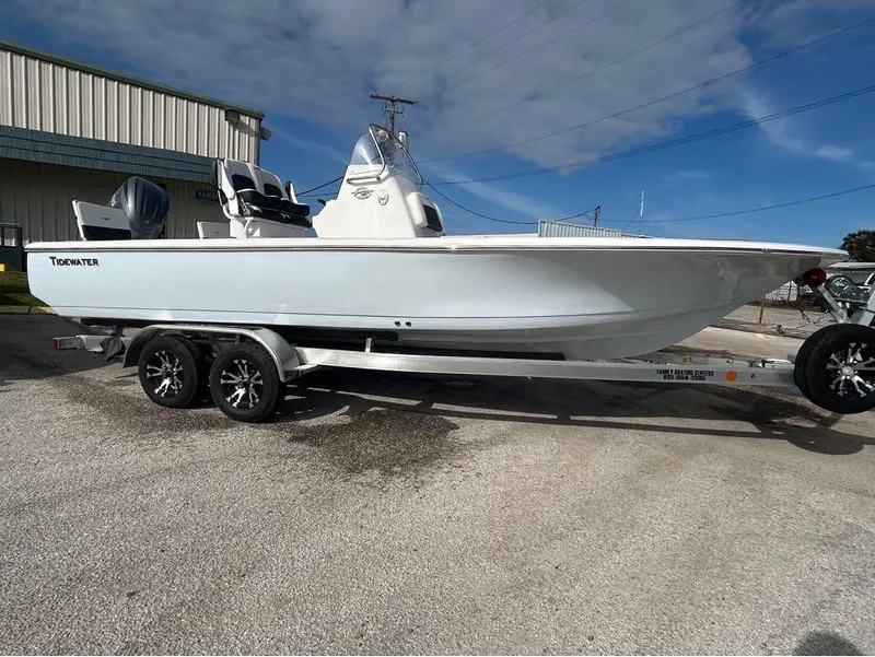 Slide: The Image of 2025 Tidewater 2110 Baymax boat on trailer, parked outdoors. - 11