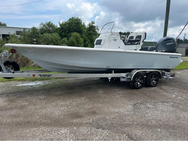 Slide: The Image of 2025 Tidewater 2110 Baymax boat on trailer, parked outdoors. - 12