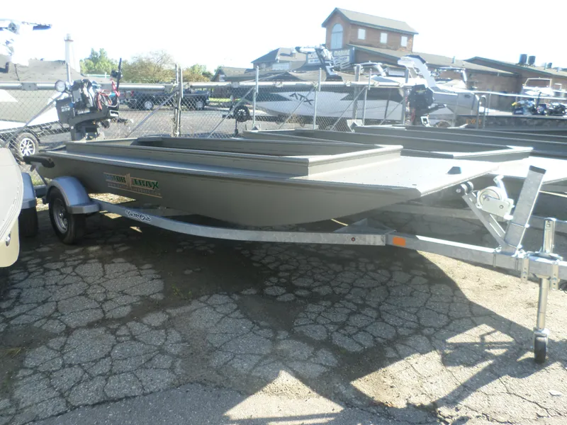 Slide: The Image of 2024 Gator Trax 16' Marsh Series boat on trailer in outdoor lot. - 1