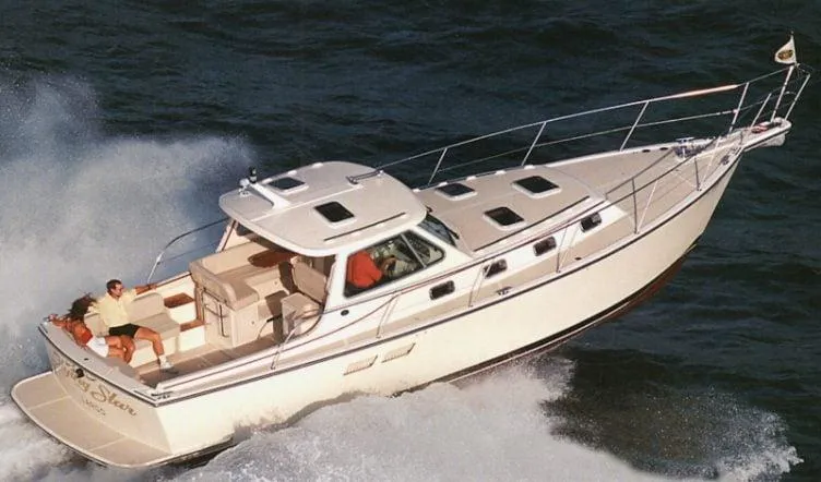 The Image of 2002 Island Packet 360 yacht cruising on open water. - 0