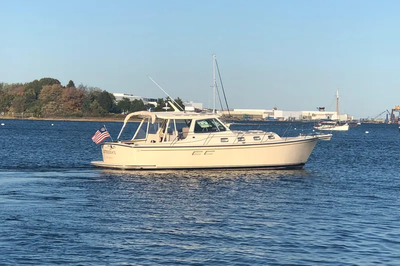 Slide: The Image of 2002 Island Packet 360 boat cruising on calm waters. - 1