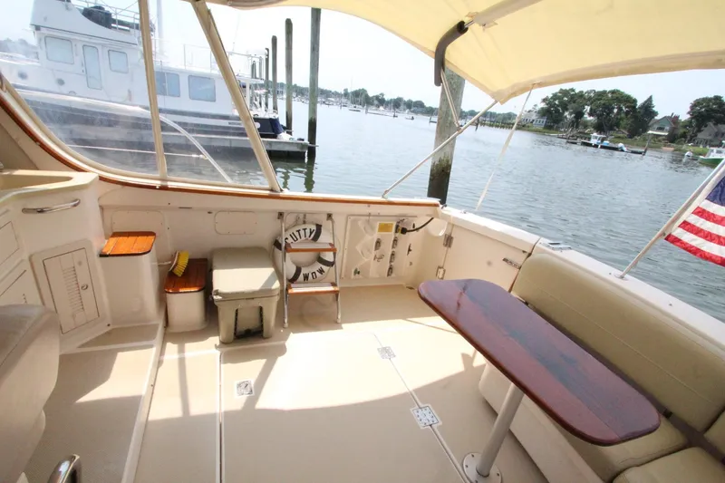 Slide: The Image of Interior view of 2002 Island Packet 360 yacht with seating area and table. - 11