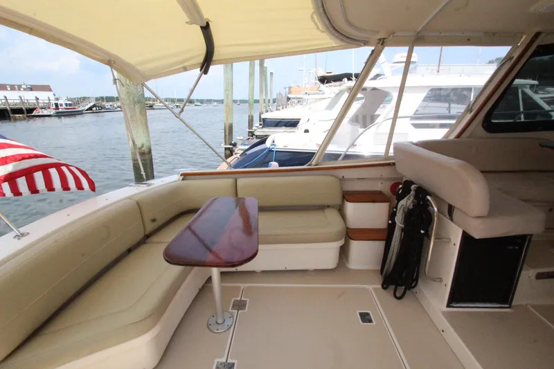 Slide: The Image of Interior of a 2002 Island Packet 360 yacht with seating and table. - 13