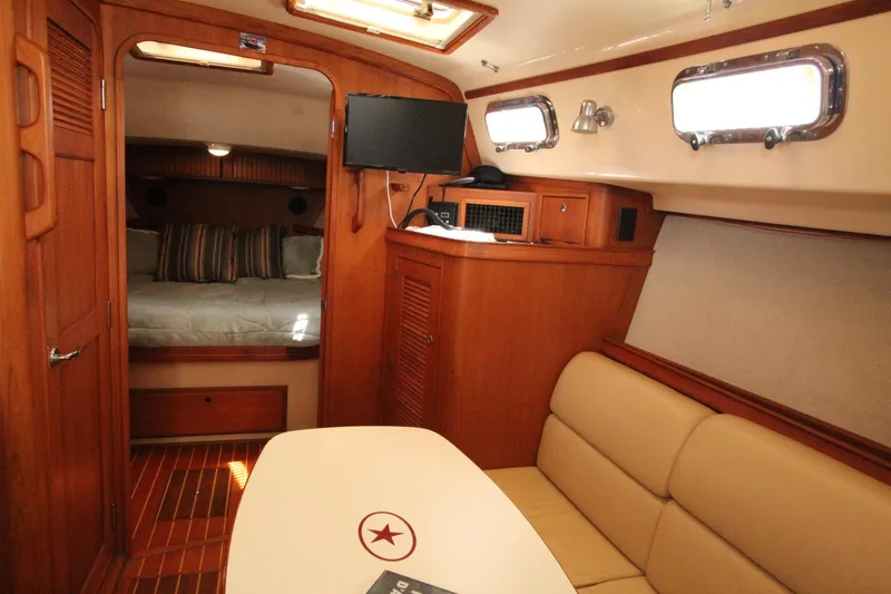 Slide: The Image of Interior of a 2002 Island Packet 360 yacht with cozy living area. - 18