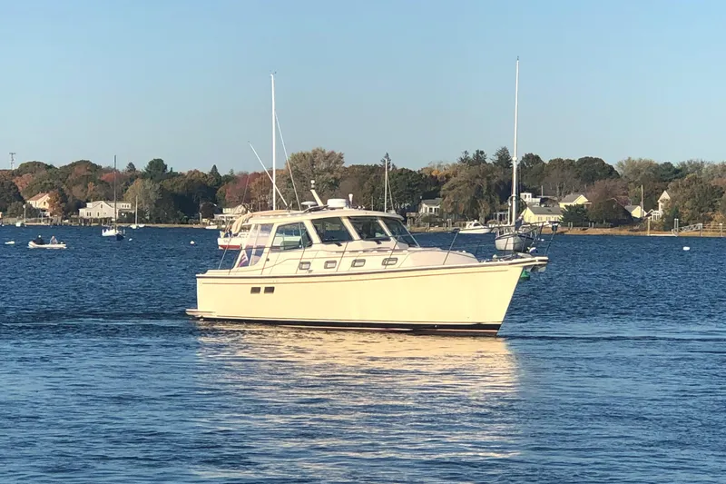 Slide: The Image of 2002 Island Packet 360 boat on calm waters. - 2