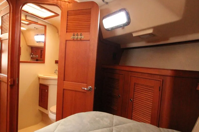Slide: The Image of Interior of a 2002 Island Packet 360 yacht with wooden cabinetry. - 22