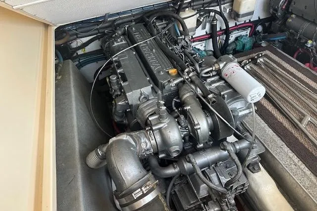 Slide: The Image of Engine compartment of a 2002 Island Packet Packet Craft 36 boat, showcasing detailed machinery. - 29