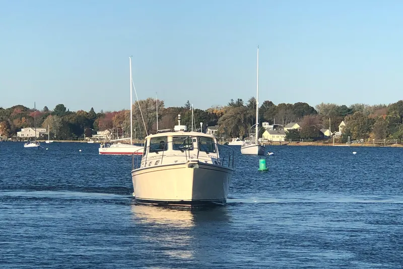 Slide: The Image of 2002 Island Packet 360 boat on calm water. - 3