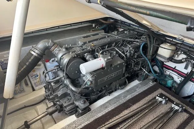 Slide: The Image of Engine compartment of a 2002 Island Packet Packet Craft 36, showcasing detailed mechanical components. - 30