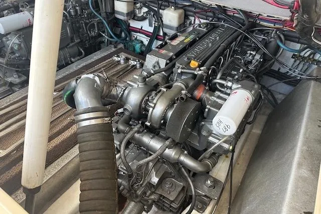 Slide: The Image of Engine compartment of a 2002 Island Packet Packet Craft 36 boat, showcasing detailed machinery. - 31