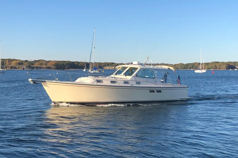 Slide: The Image of 2002 Island Packet 360 yacht cruising on calm waters. - 5