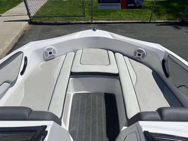 Slide: The Image of 2023 Yamaha AR 190 jet boat interior with cushioned seating and speakers. - 13