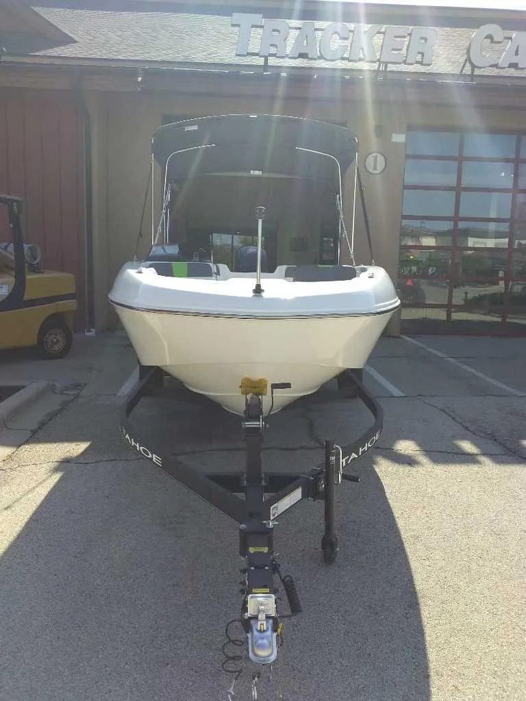 Slide: The Image of 2024 Tahoe T18 boat on trailer outside dealership, front view. - 4