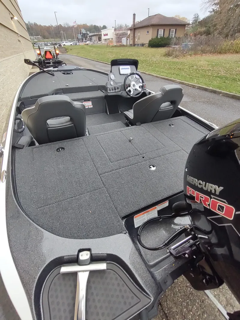 Slide: The Image of 2024 Nitro Z18 boat with Mercury Pro engine, featuring spacious deck and dual seating. - 6