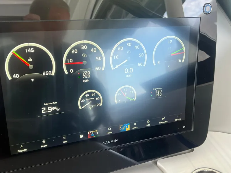 Slide: The Image of Garmin display showing Regal LS36 2022 boat gauges and metrics, including speed and fuel rate. - 12