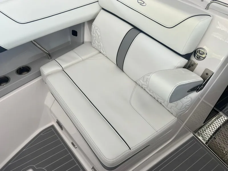 Slide: The Image of Luxurious white seating on 2022 Regal LS36 boat, featuring elegant design and comfortable upholstery. - 27