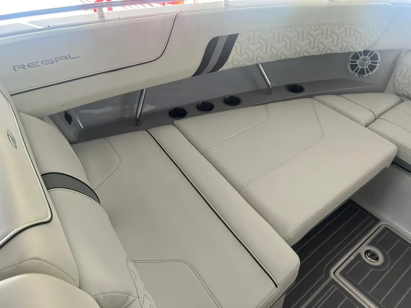 Slide: The Image of 2022 Regal LS36 boat interior with luxurious seating and modern design. - 28