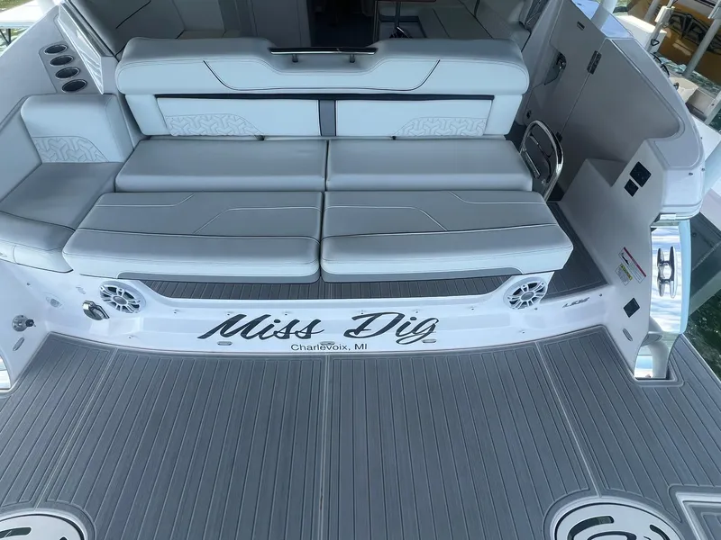 Slide: The Image of 2022 Regal LS36 boat interior with white seating and "Miss Dig" nameplate. - 6
